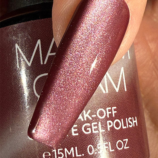 Madam Glam Wine & Berries nail polish display featuring deep red and berry shades with a glossy finish.