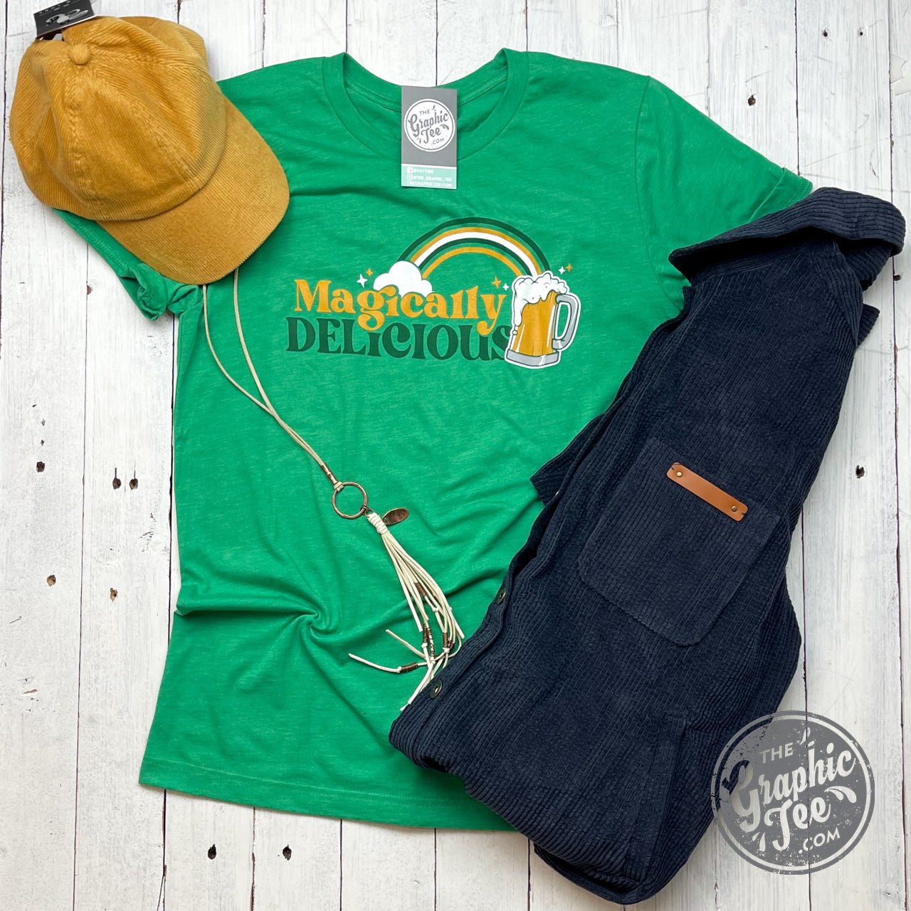 Magically Delicious short sleeve graphic T-shirt by The Graphic Tee featuring colorful, whimsical design on a casual tee.
