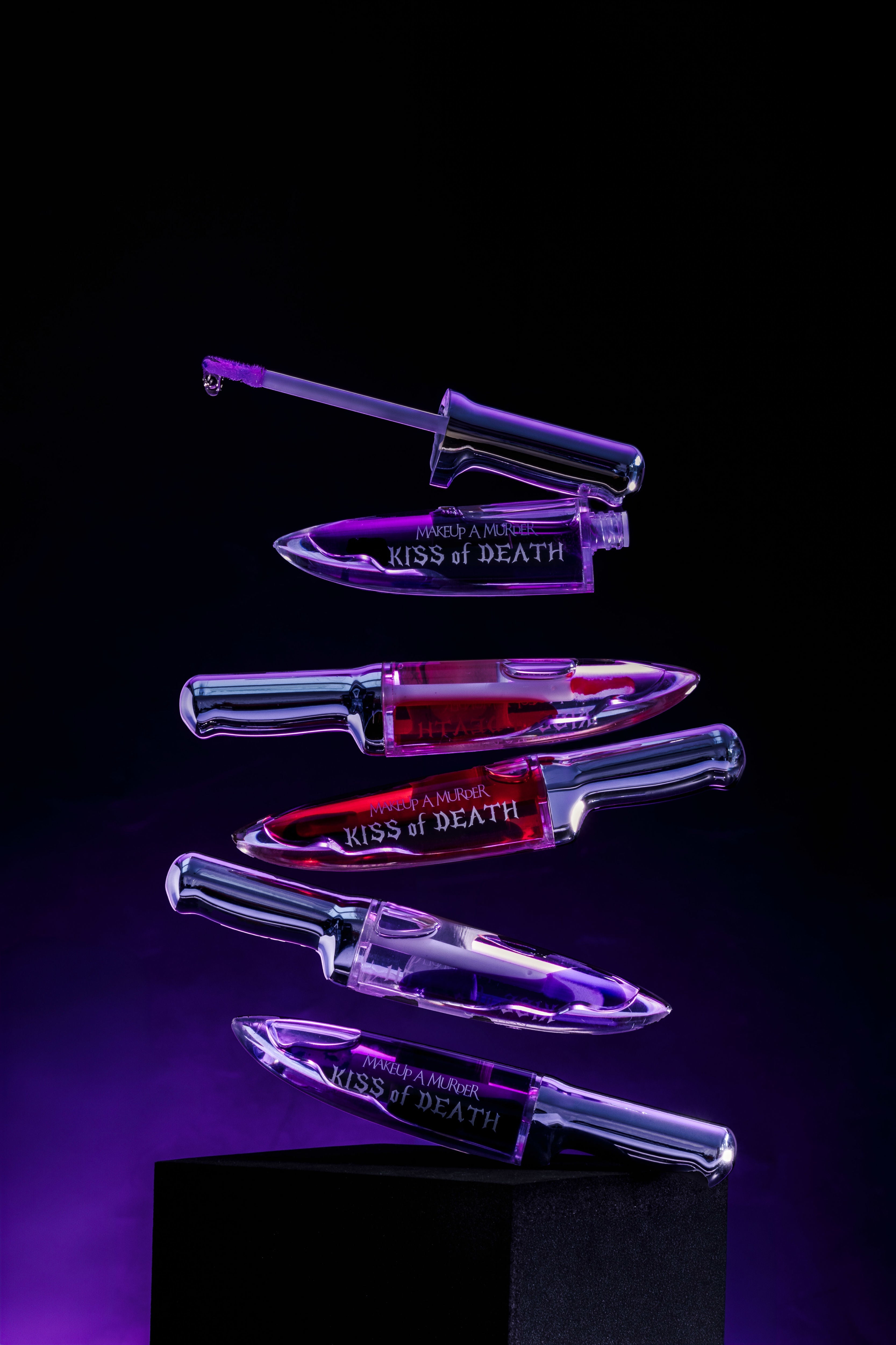 KISS of DEATH Bloody Lip Oils full collection by Makeup A Murder, INC showcasing vibrant, bloody-themed lip oil shades in a master set.