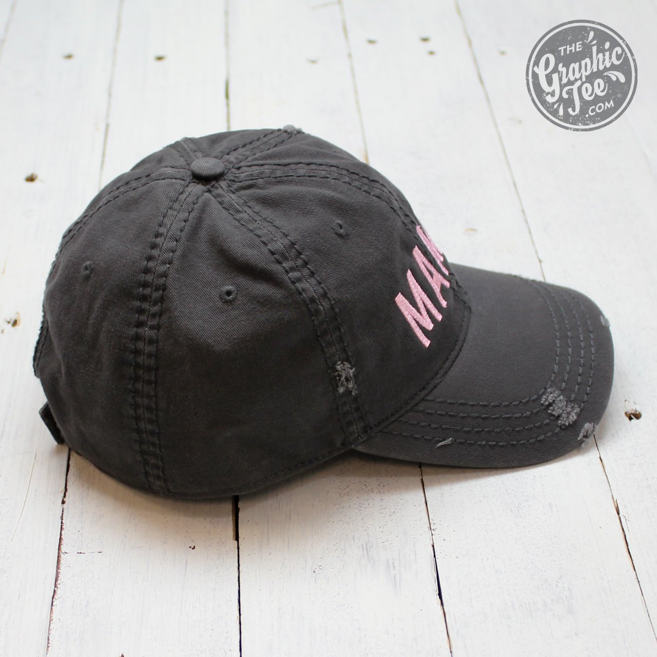 Charcoal distressed canvas cap labeled Mama by The Graphic Tee, featuring a classic brim and casual style.