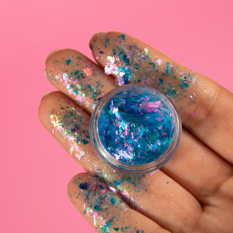 NABA Cosmetics USA Flake Carlin makeup product with shimmering flakes in a sleek container, ideal for creative cosmetic looks.