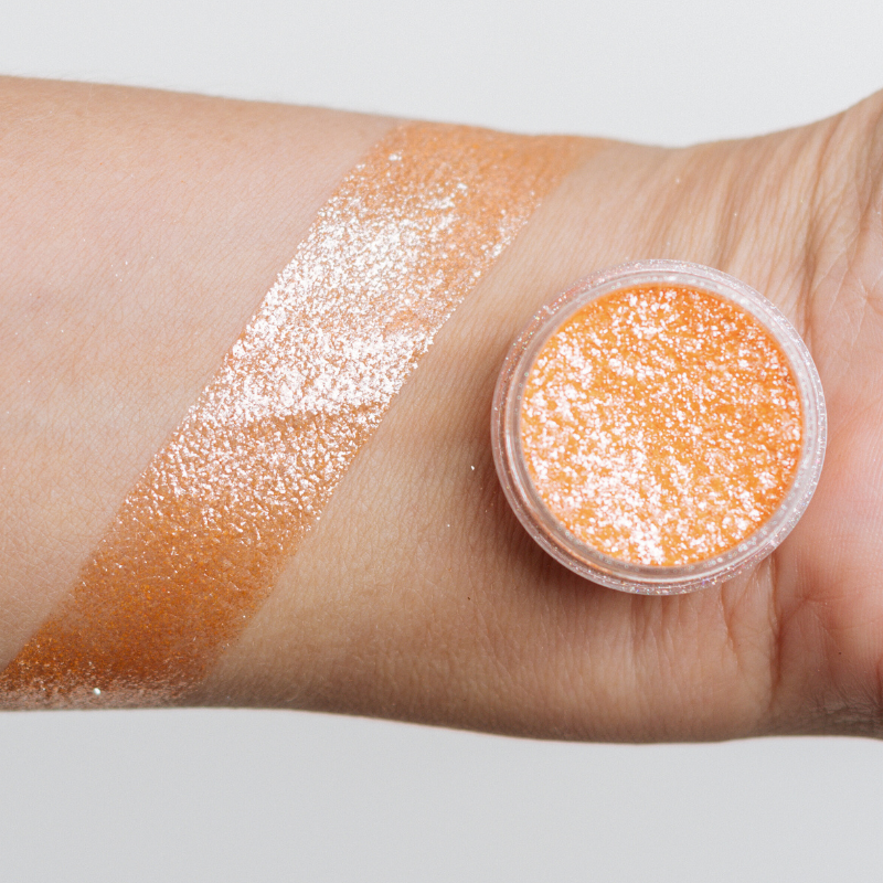 NABA Cosmetics USA Miracle Pigment in vibrant, shimmering color, shown in a close-up image with a smooth, reflective surface.