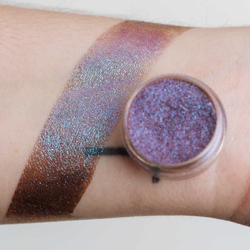 NABA Cosmetics USA Pandora Pigment in a small jar with shimmering pink and purple loose cosmetic pigment powder.