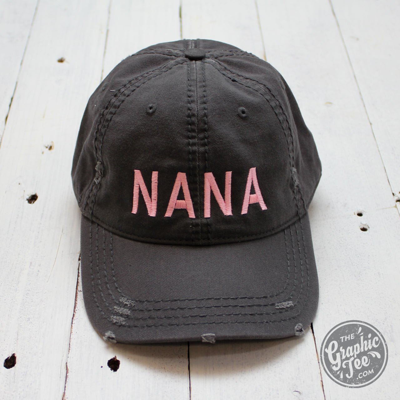 Charcoal distressed canvas cap by The Graphic Tee featuring a casual, worn-in style and adjustable strap.