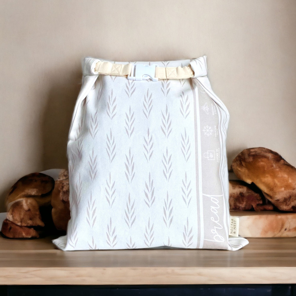 Reusable Nectar & Nest beeswax bread bags for homemade bread and sourdough, showing natural beeswax-coated fabric and bread inside.