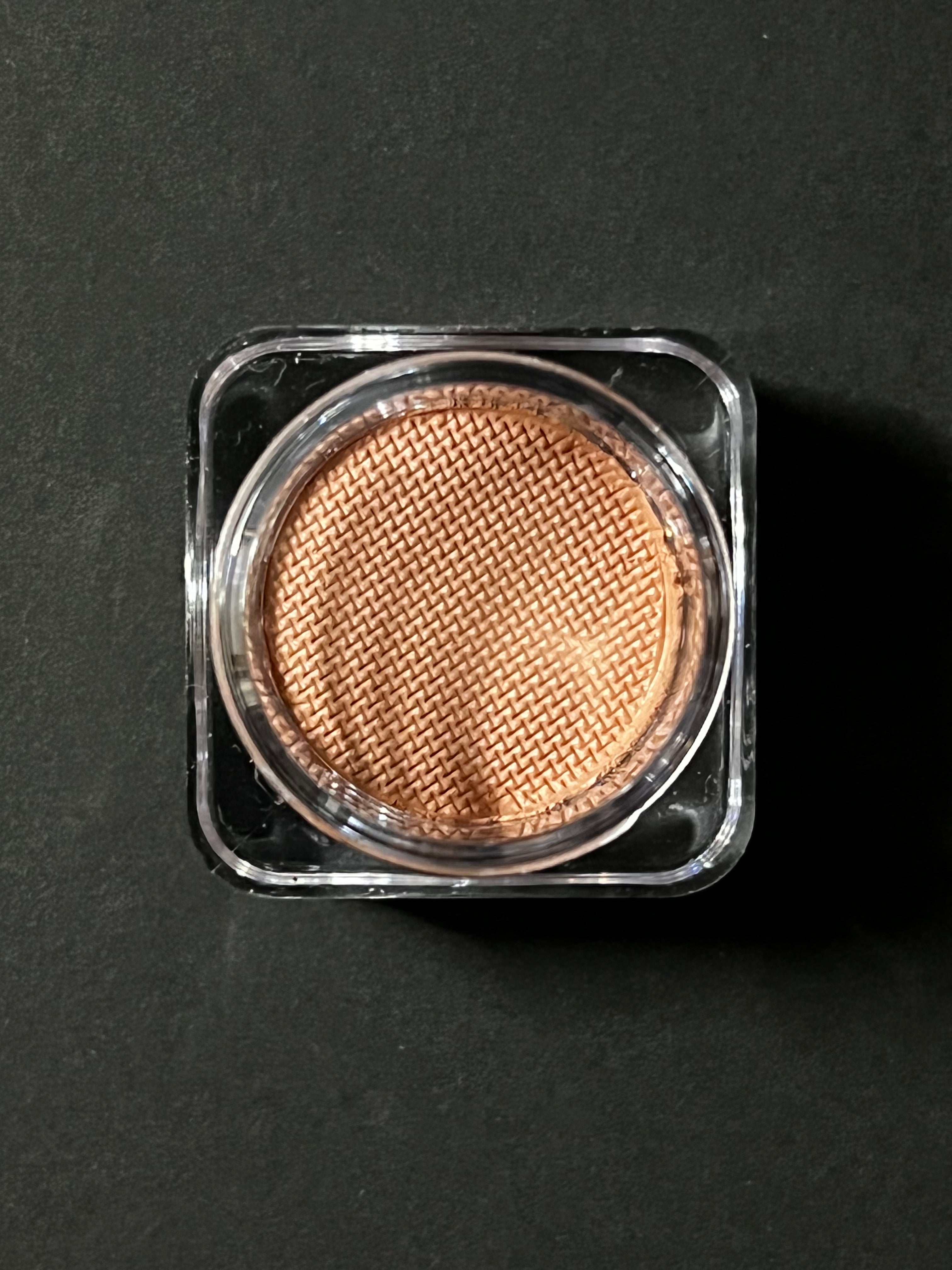 Nekoyanin Latte Brown Water Activated Graphic Liner, a close-up of the brown eyeliner with a water-activated design on a white background.