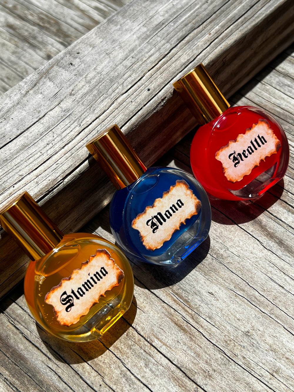 Nekoyanin Magic Potions bottles with colorful labels, set against a neutral background, showcasing the product packaging.