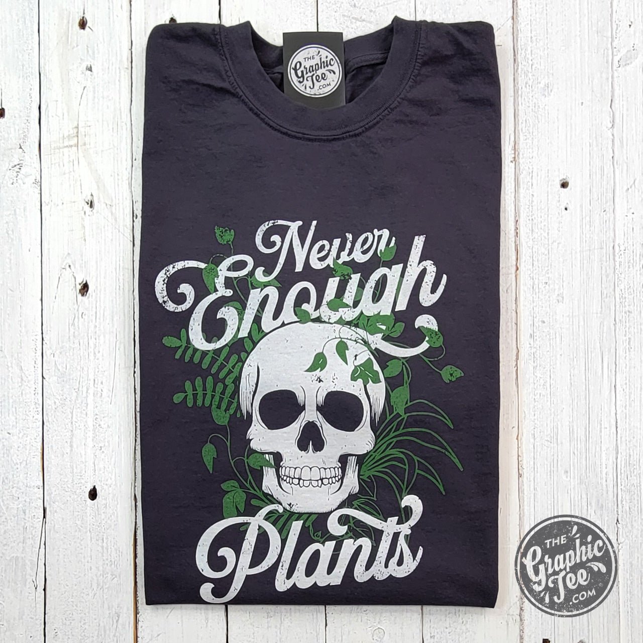 Never Enough Plants pigment dyed graphic T-shirt by The Graphic Tee, showing a colorful plant design on soft cotton fabric.