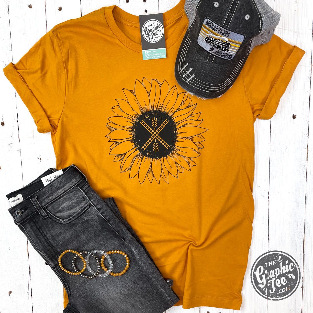 Unisex SS Graphic Tee featuring a sunflower and Newton flag design, by The Graphic Tee, displayed on a white background.