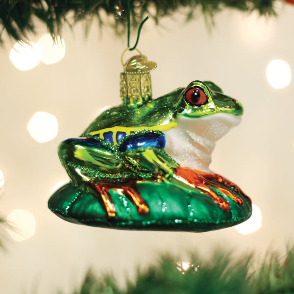 Red-eyed Tree Frog ornament by Old World Christmas featuring vibrant green body, red eyes, and detailed tree frog design.
