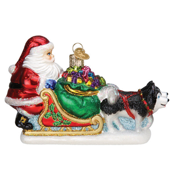 Santa's dog sled ornament from Old World Christmas featuring a detailed festive dog sled with Santa figurine.