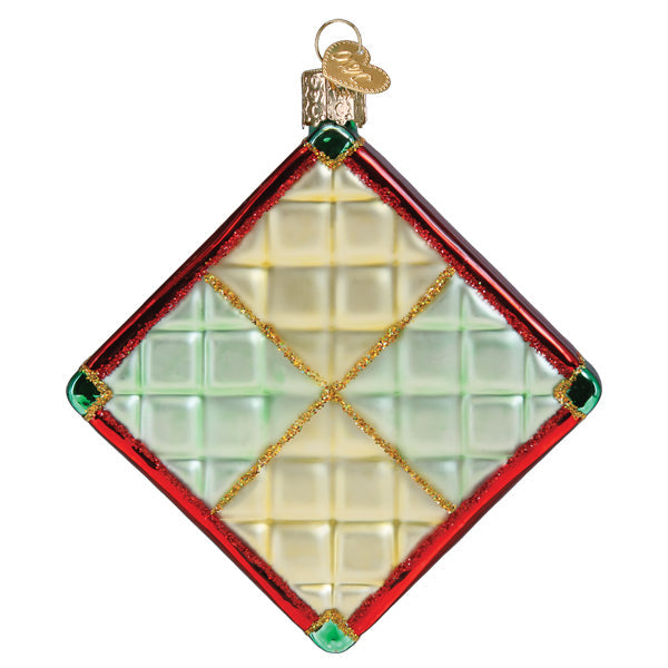 Old World Christmas Christmas quilt ornament featuring festive fabric patchwork and holiday-themed design.