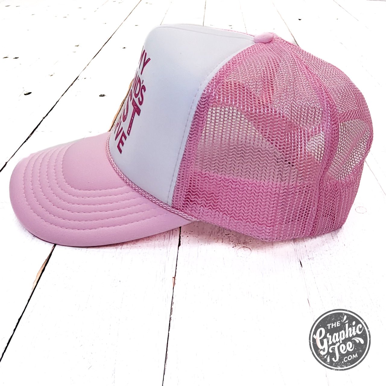 Pink and white foam trucker cap with humorous "On My Husband's Last Nerve" graphic, made by The Graphic Tee.