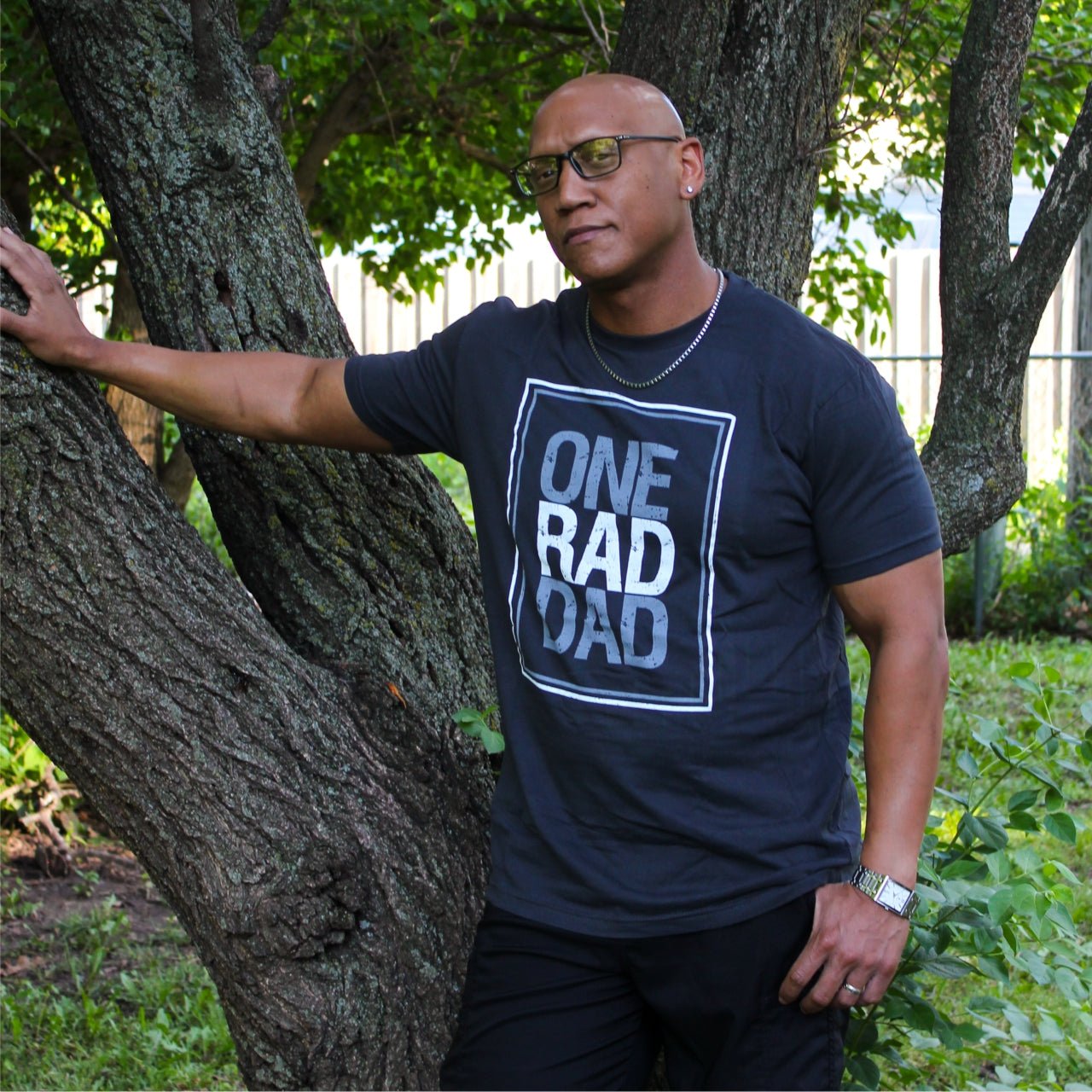 Adult SS graphic tee from The Graphic Tee featuring a "One Rad Dad" design on soft cotton fabric.