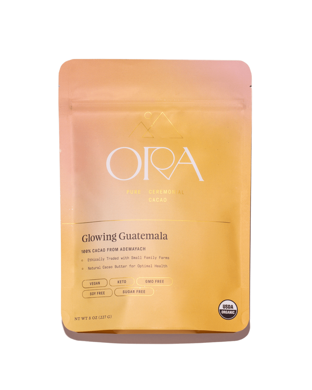 Pure 100% ceremonial cacao from Ora Cacao, Glowing Guatemala, in a 1 lb package showing rich cacao beans and packaging.