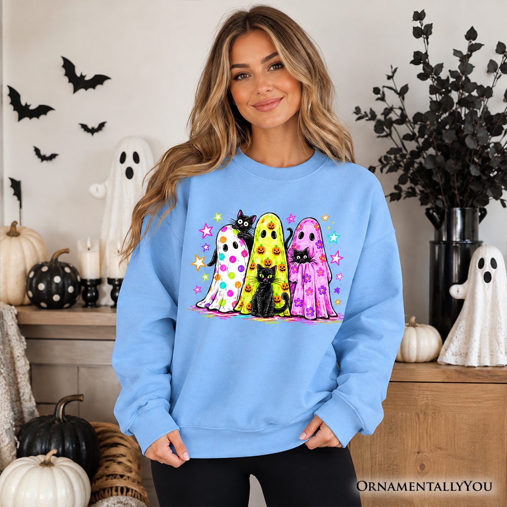 Colorful ghosts and black cats Halloween sweatshirt by OrnamentallyYou, featuring neon spooky season design on Carolina blue fabric.