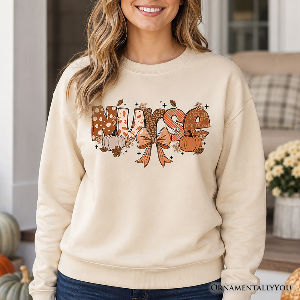 Nurse Coquette Autumn Sweatshirt by OrnamentallyYou featuring cozy fall pumpkin design, perfect for healthcare heroes during autumn.