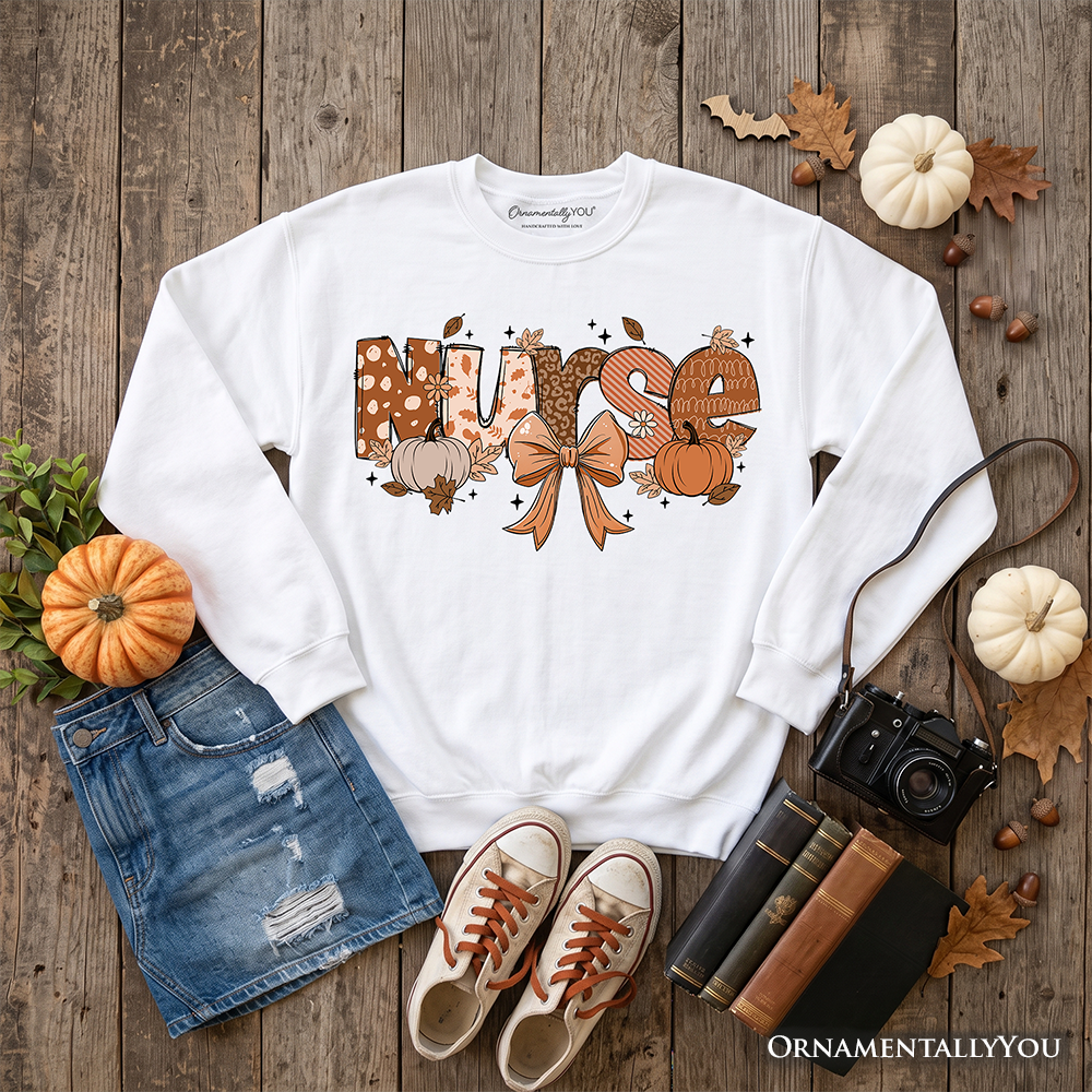 Nurse Coquette Autumn Sweatshirt by OrnamentallyYou featuring cozy fall pumpkin design, perfect for healthcare heroes.