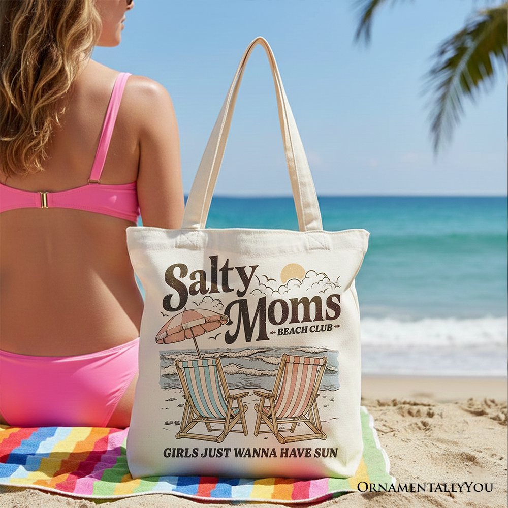 Beige Salty Moms Beach Club canvas tote bag with retro summer design, perfect for ocean-loving mothers.