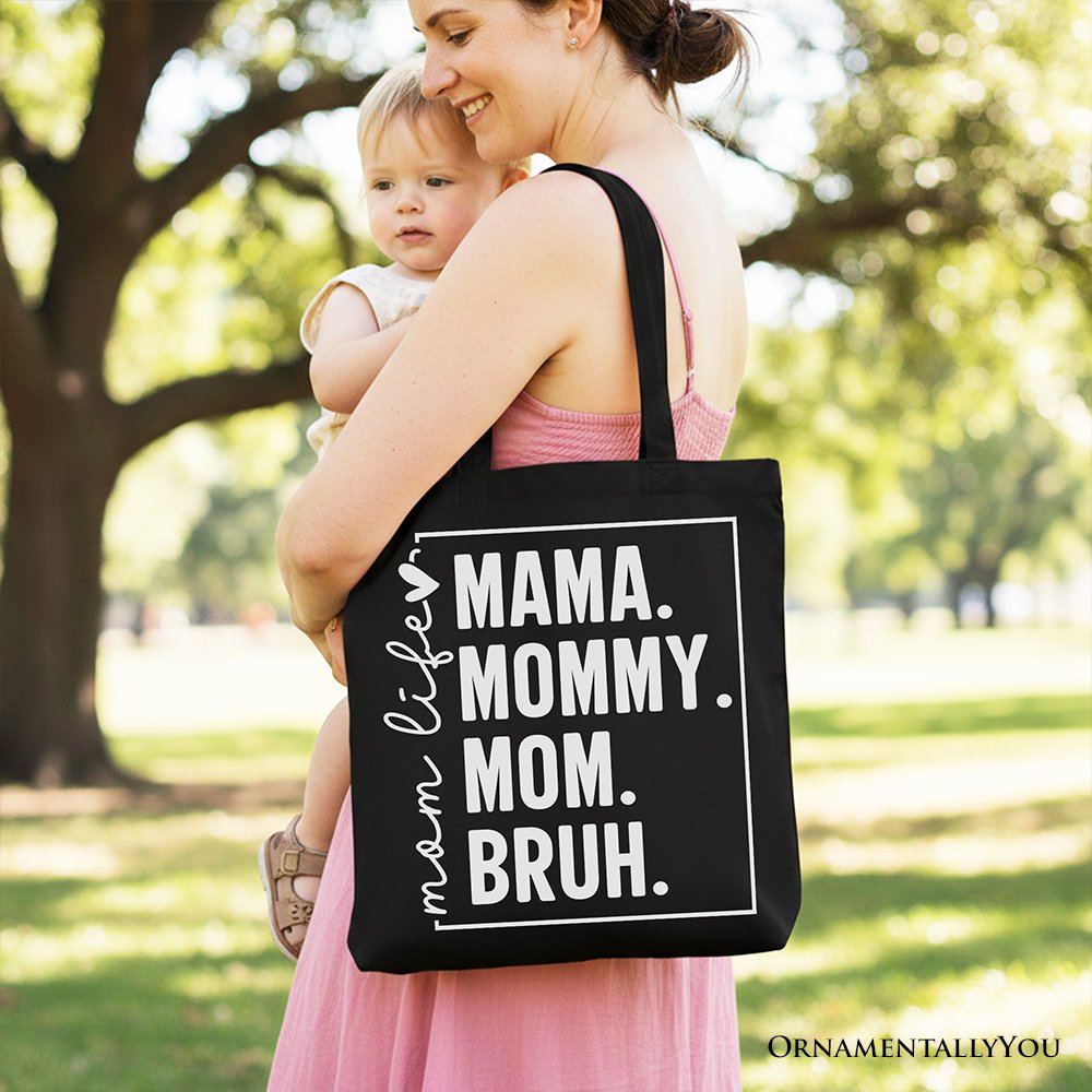 Black canvas tote bag with humorous "Mom's Life" print, stylish minimalist design, ideal for mothers and shoppers.