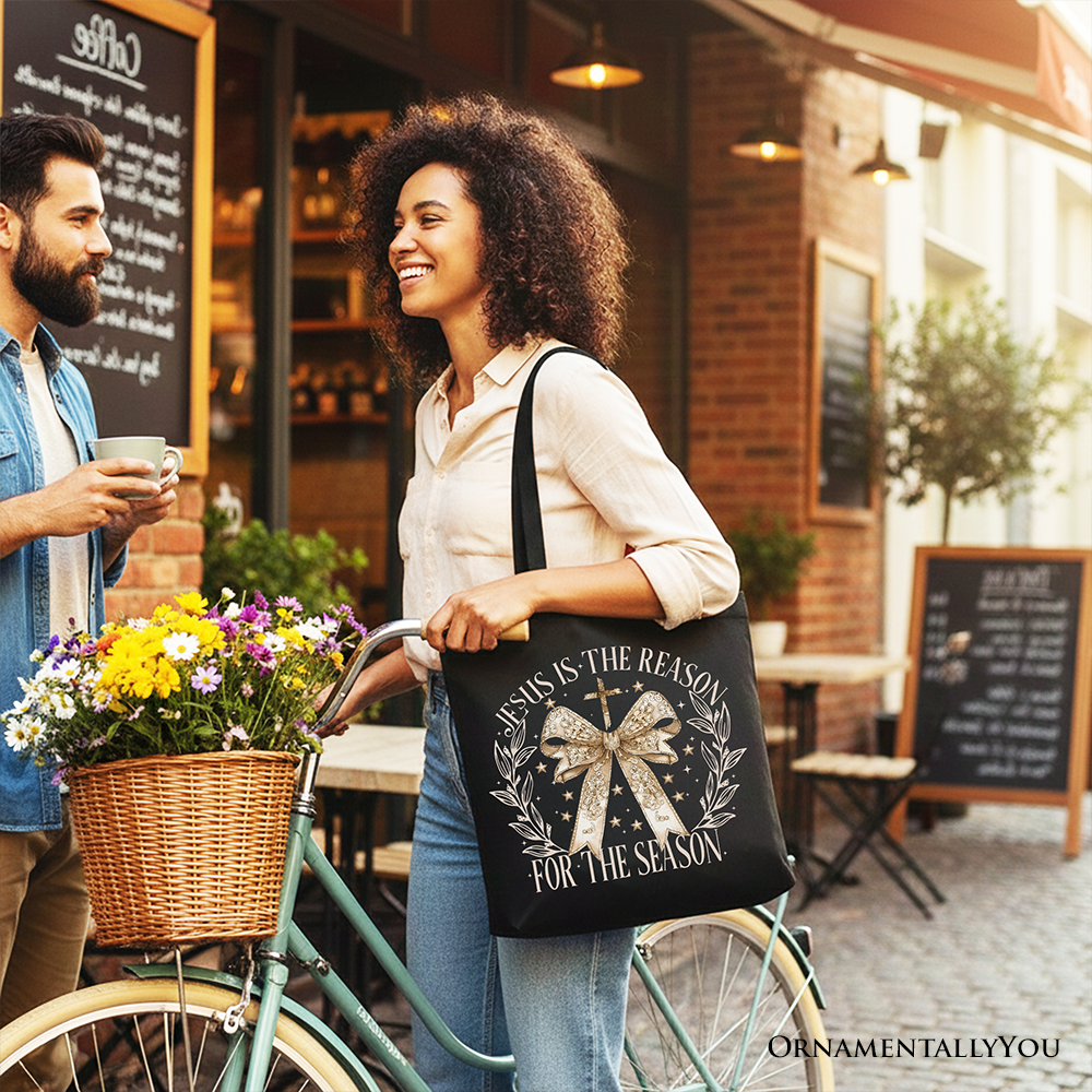 Black Jesus Is the Reason Christmas tote bag by OrnamentallyYou with a gold bow cross design, perfect for faithful women.