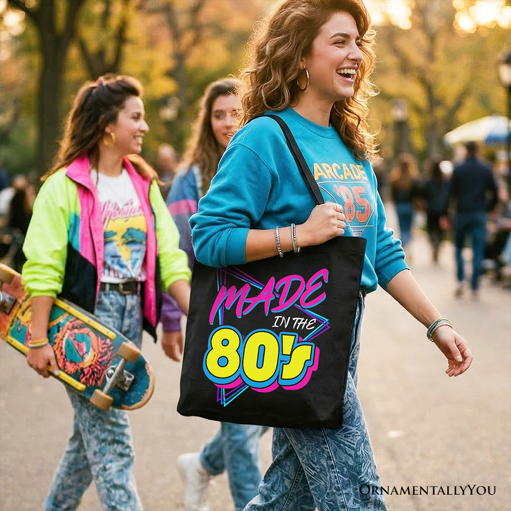 Black tote bag by OrnamentallyYou featuring neon retro 80s design, perfect for eighties kids and vintage gift shoppers.