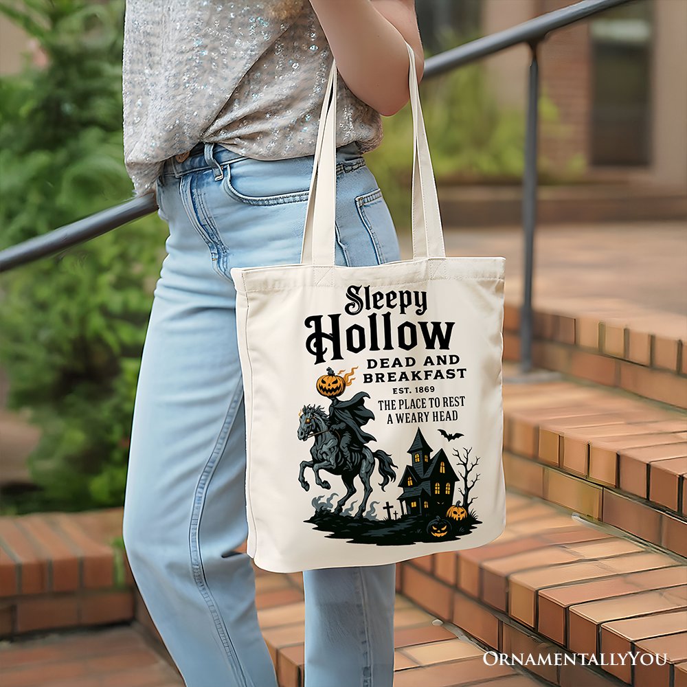 White canvas tote bag featuring a Headless Horseman Sleepy Hollow Halloween design by OrnamentallyYou, with retro Dead and Breakfast theme.