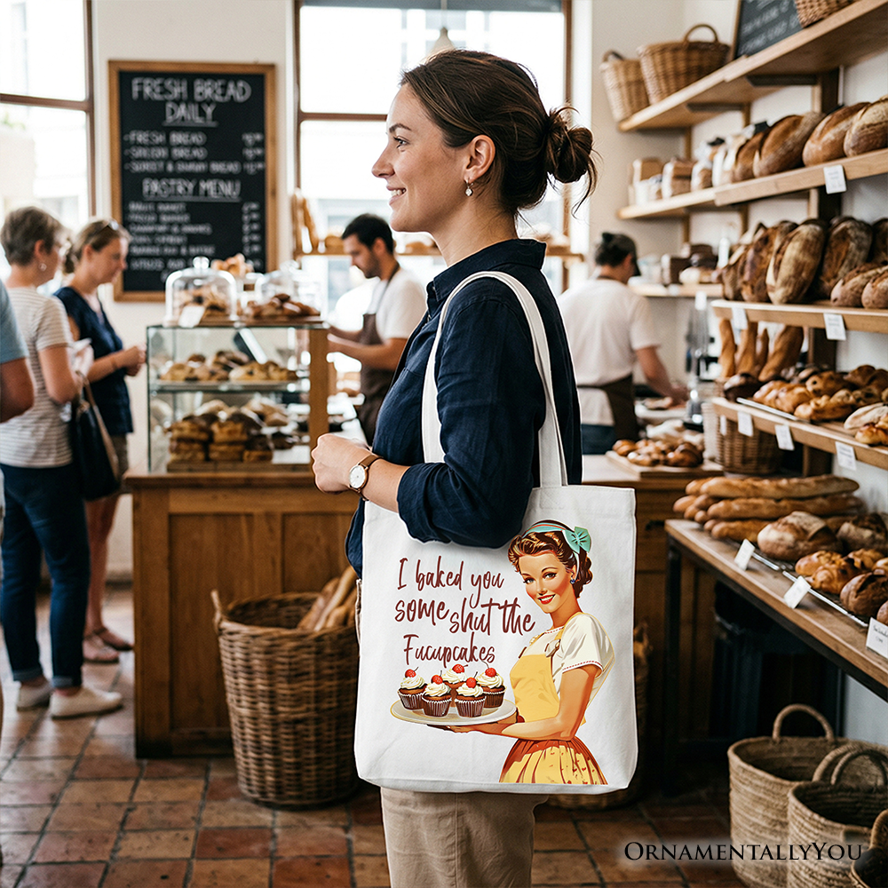 White tote bag featuring humorous "I Baked You Some Shut The Fucupcakes" text, perfect for fun bakers and kitchen gift lovers.