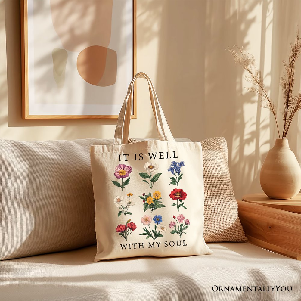 White Christian floral canvas tote bag with "It Is Well With My Soul" Bible verse design, by OrnamentallyYou.