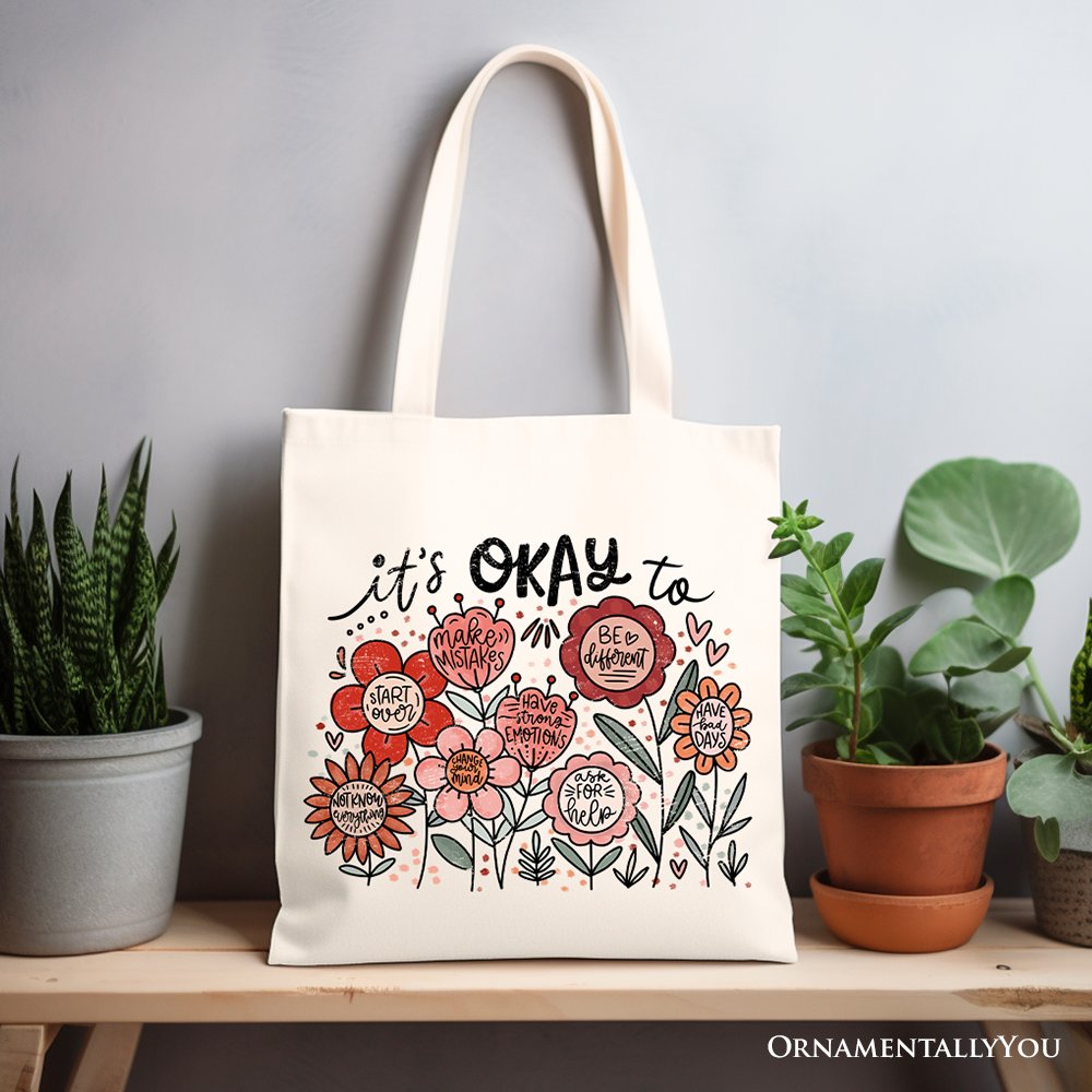White canvas tote bag with floral "It's Okay" affirmation and boho design, perfect for inspiring women.