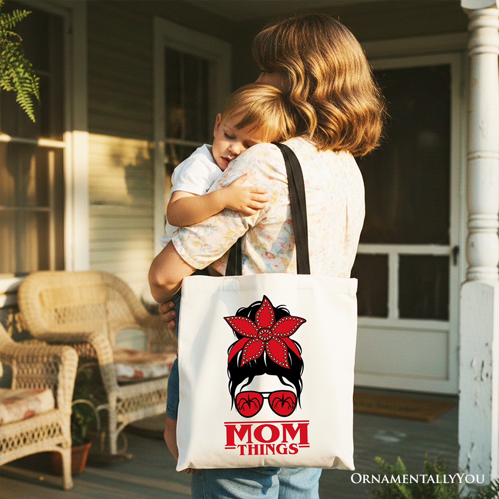 White canvas tote bag with "Mom Things" design, featuring a messy bun, retro style, red bandana glasses, perfect for family gifting.