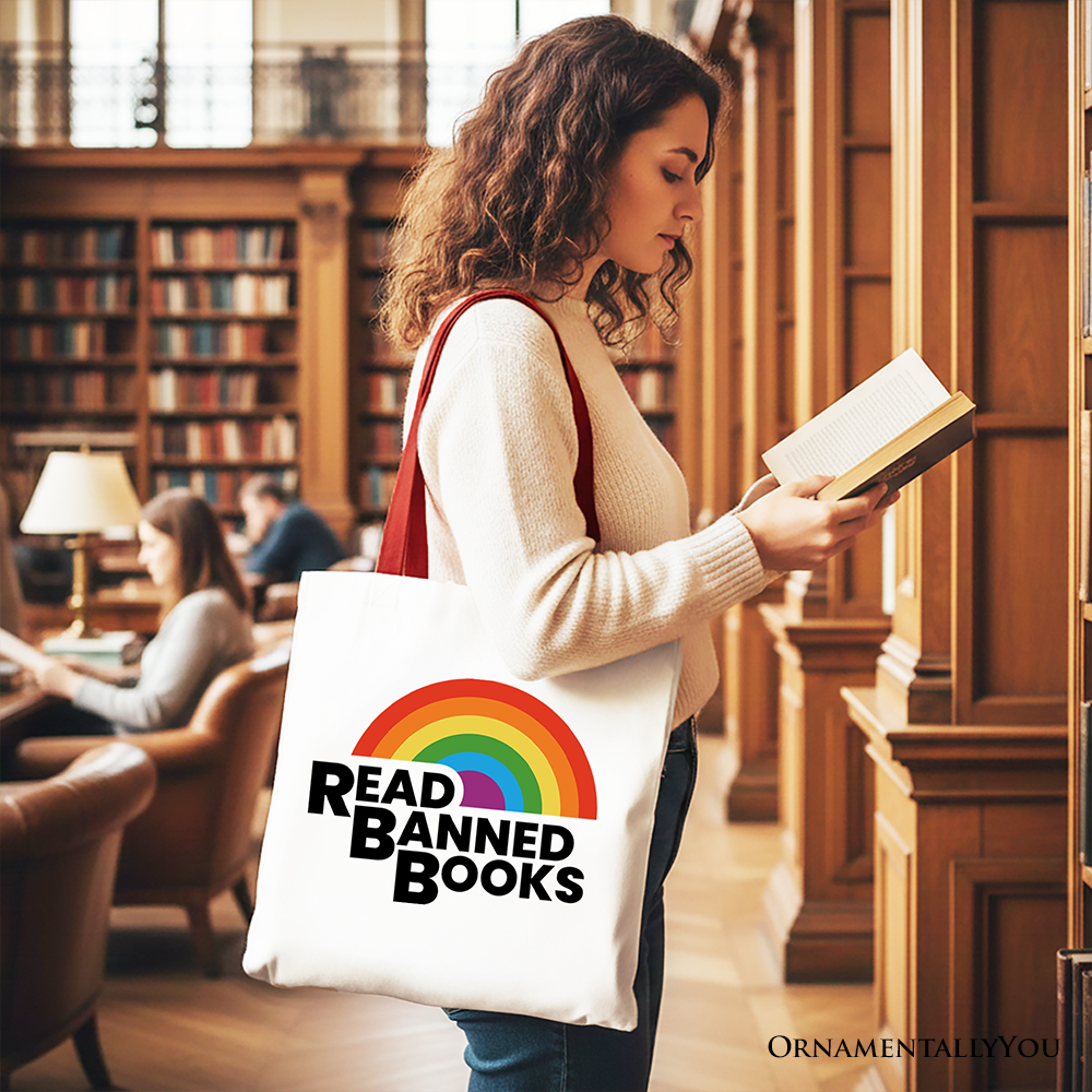 White canvas tote bag by OrnamentallyYou with rainbow read-banned books design, perfect for book lovers and shoppers.