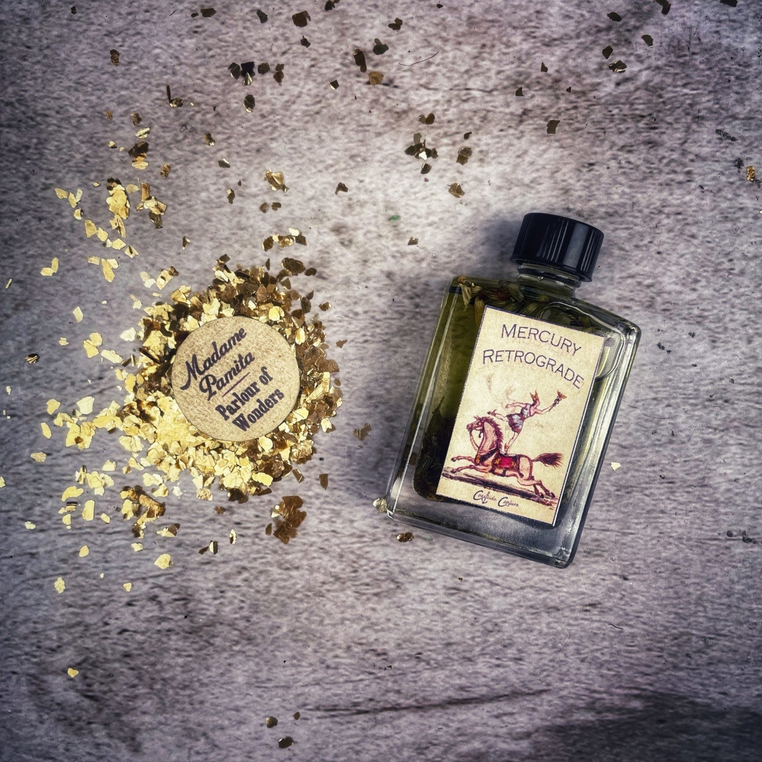Coastside Conjure Mercury Retrograde Oil by Parlour of Wonders in a 3 oz roll-on bottle, with a dark label and glass container.