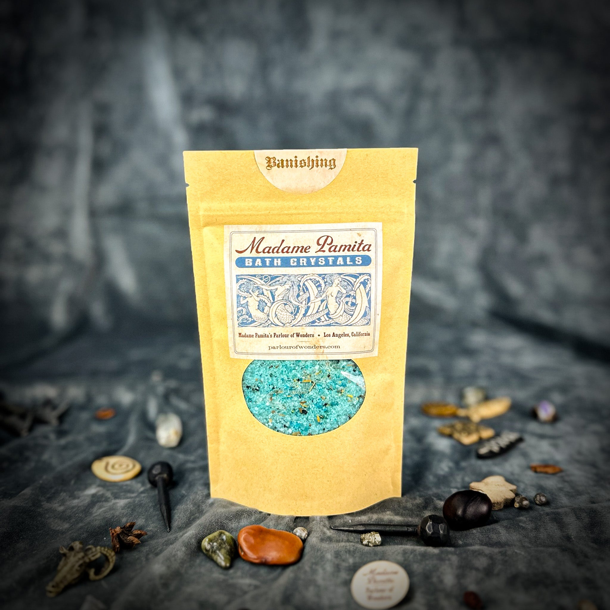 Small jar of Parlour of Wonders Banishing Bath Crystals with colorful crystals for relaxing bath experience.
