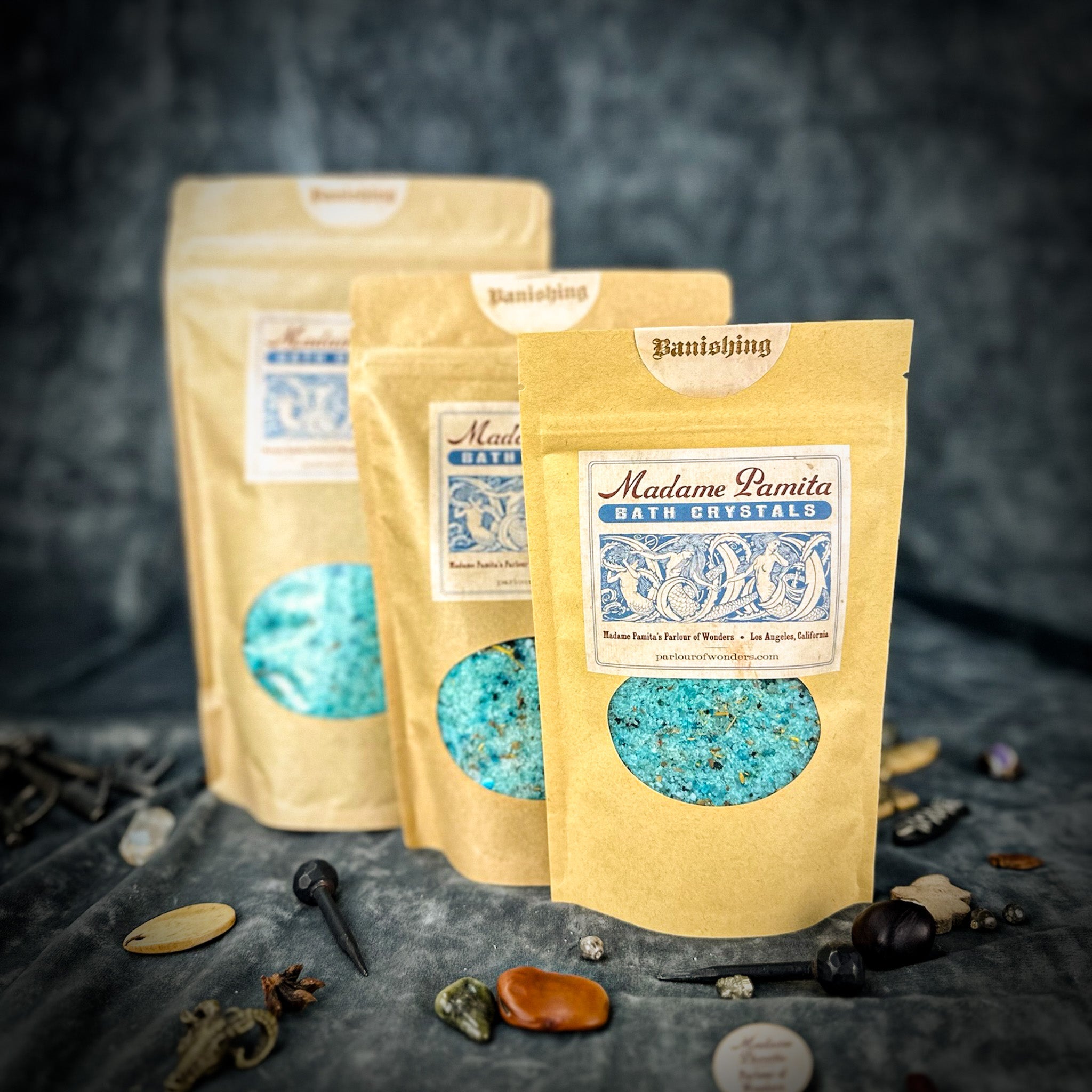 Small jar of Parlour of Wonders Banishing Bath Crystals with colorful crystals for relaxing bath experience.