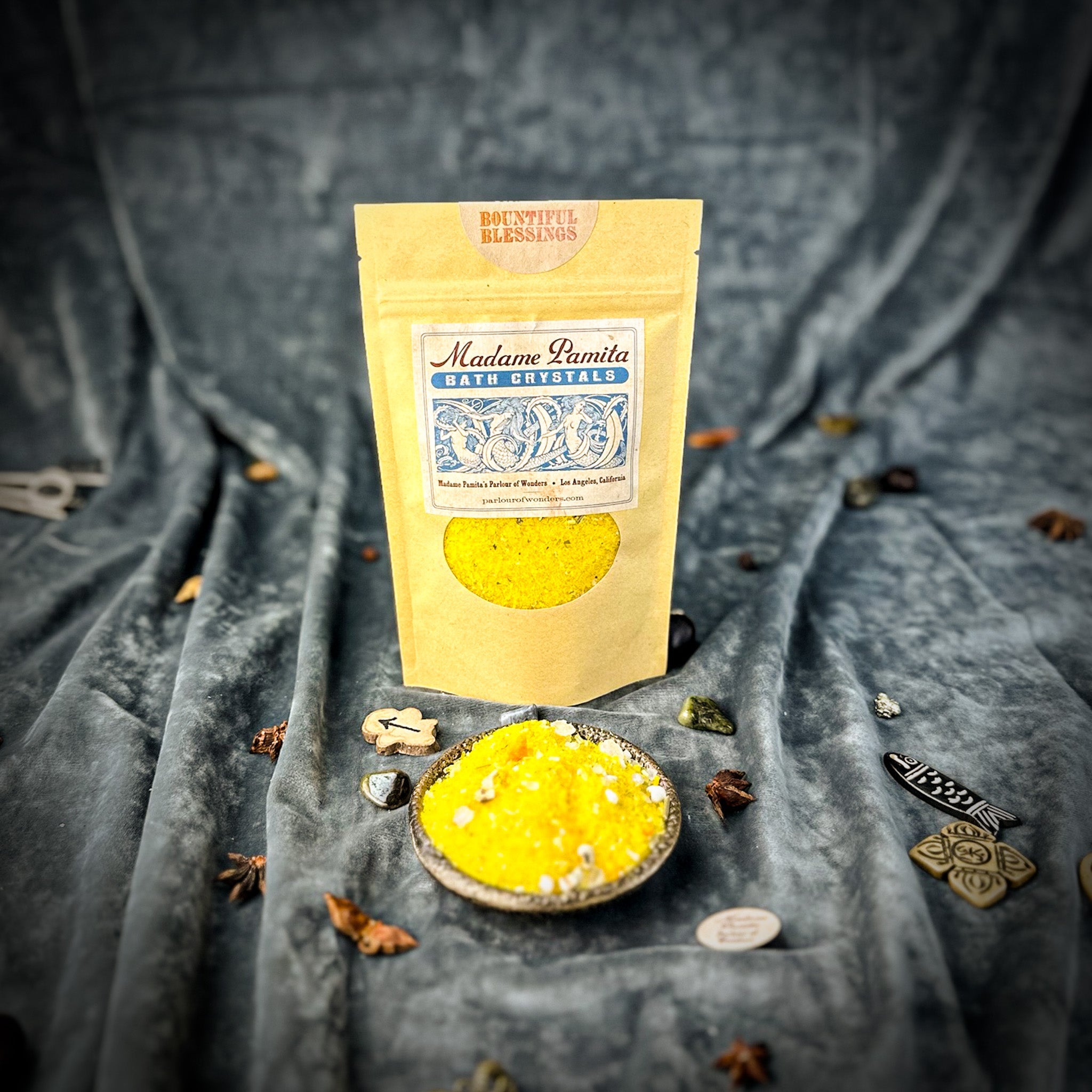 Small jar of Parlour of Wonders Bountiful Blessings Bath Crystals with colorful crystal granules for relaxing bath experience.