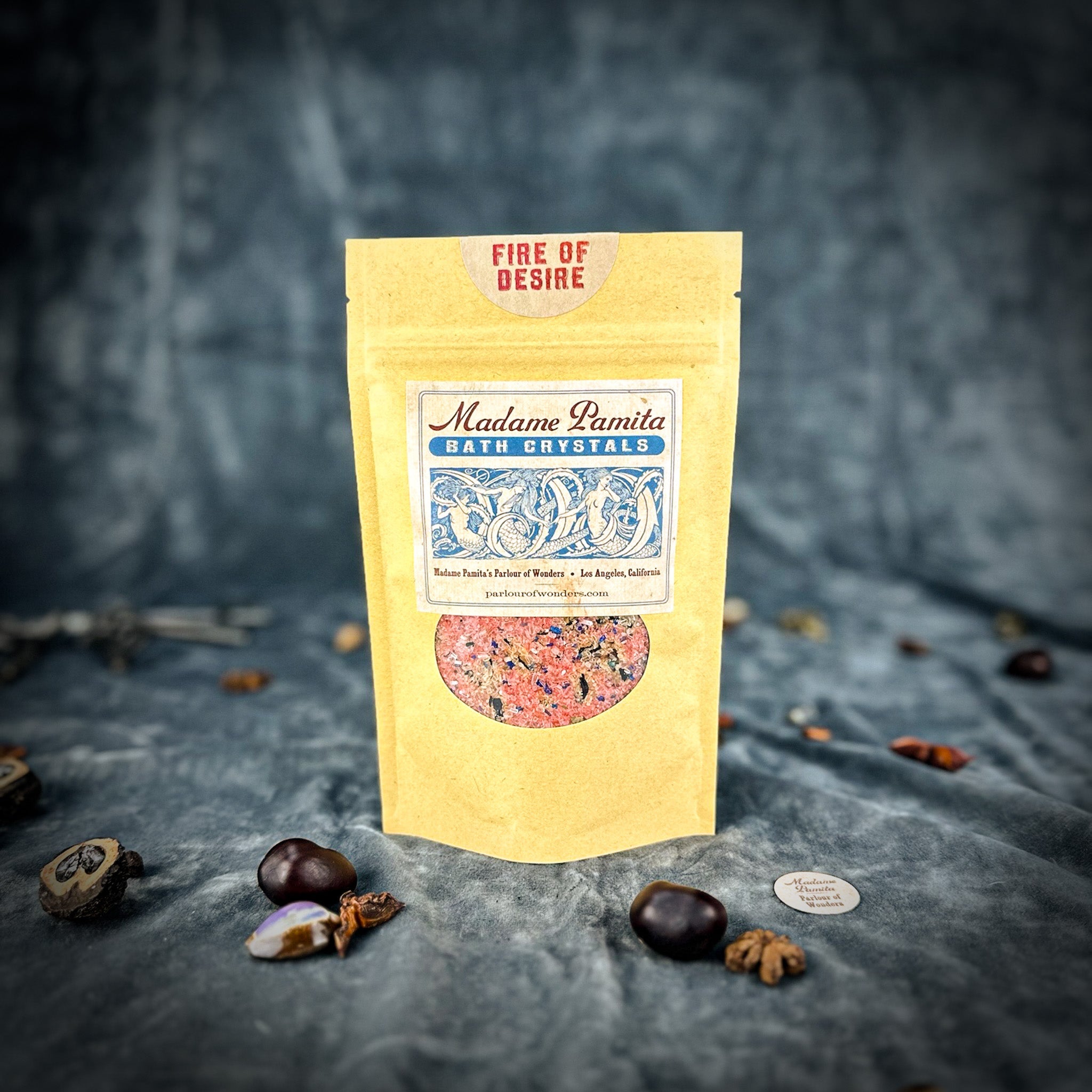 Small jar of Parlour of Wonders Fire of Desire Bath Crystals with colorful crystalline bath salts in a clear container.