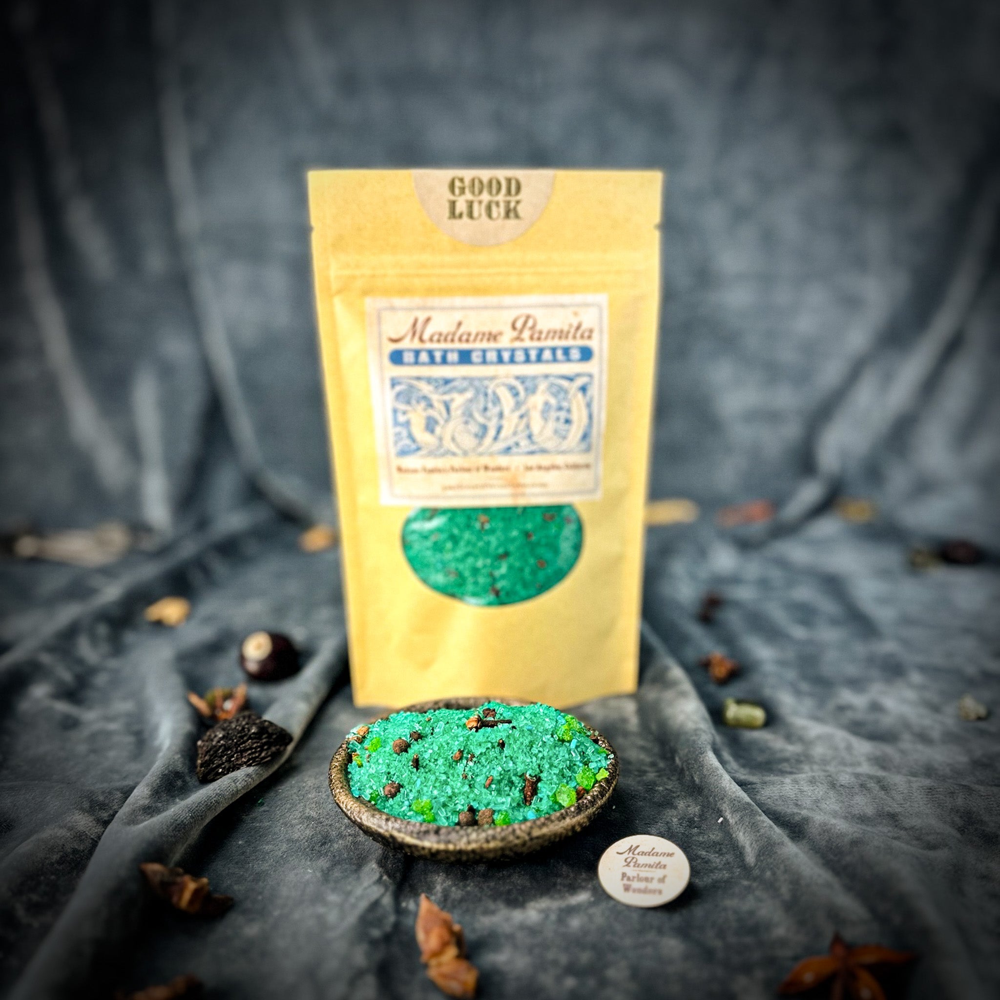 Small jar of Parlour of Wonders Good Luck Bath Crystals with colorful crystals for a relaxing bath experience.