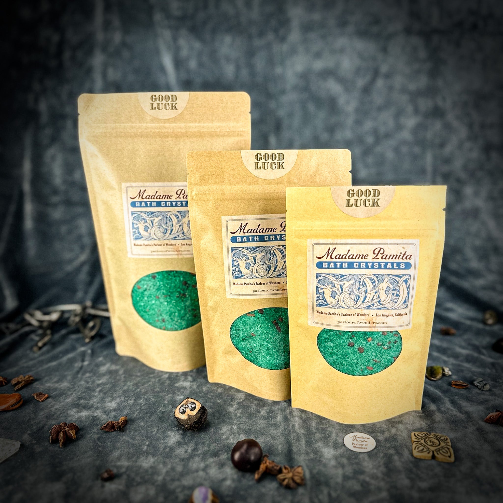 Small jar of Parlour of Wonders Good Luck Bath Crystals with colorful crystals and a decorative label for relaxing bath time.