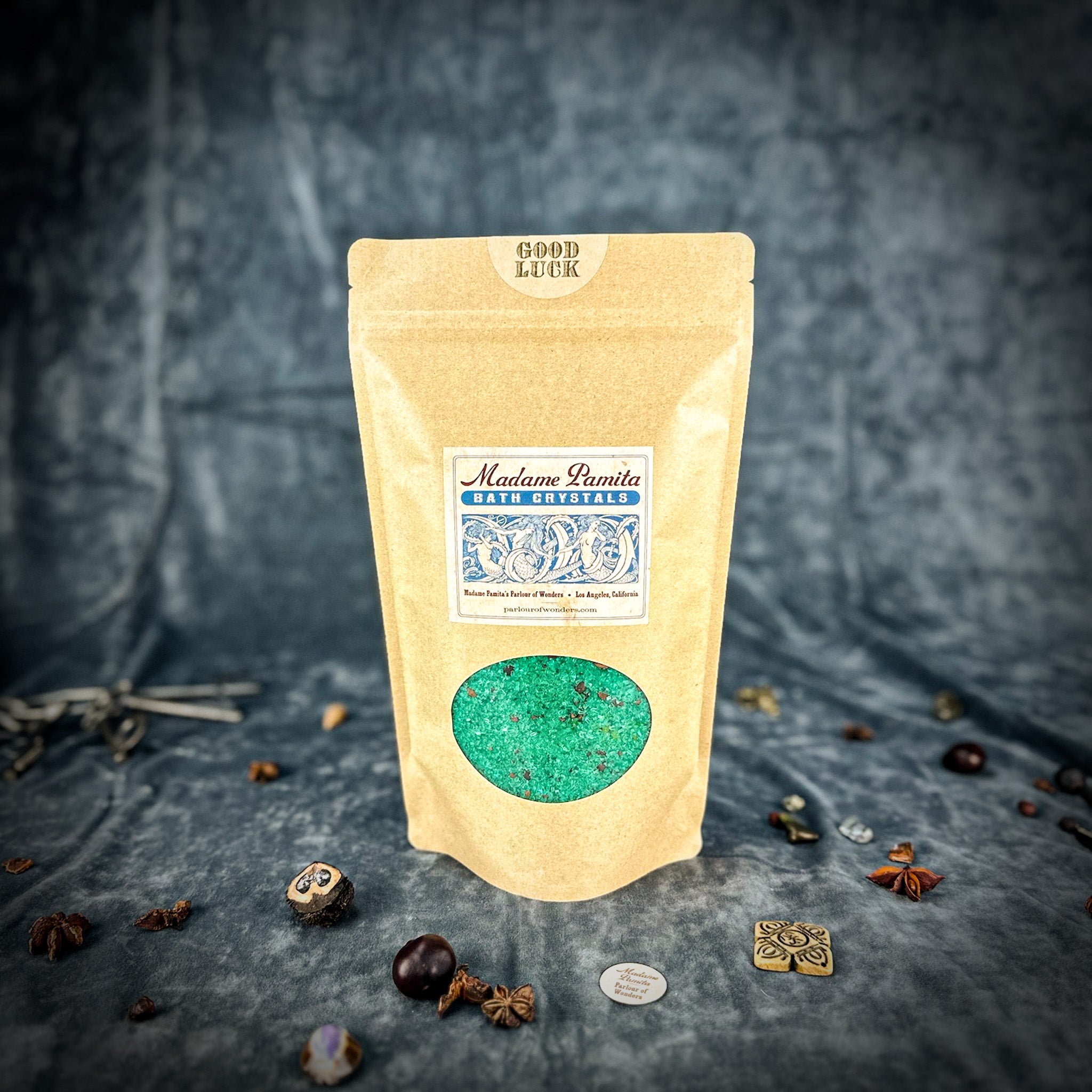 Small jar of Parlour of Wonders Good Luck Bath Crystals with colorful crystals for a relaxing bath experience.