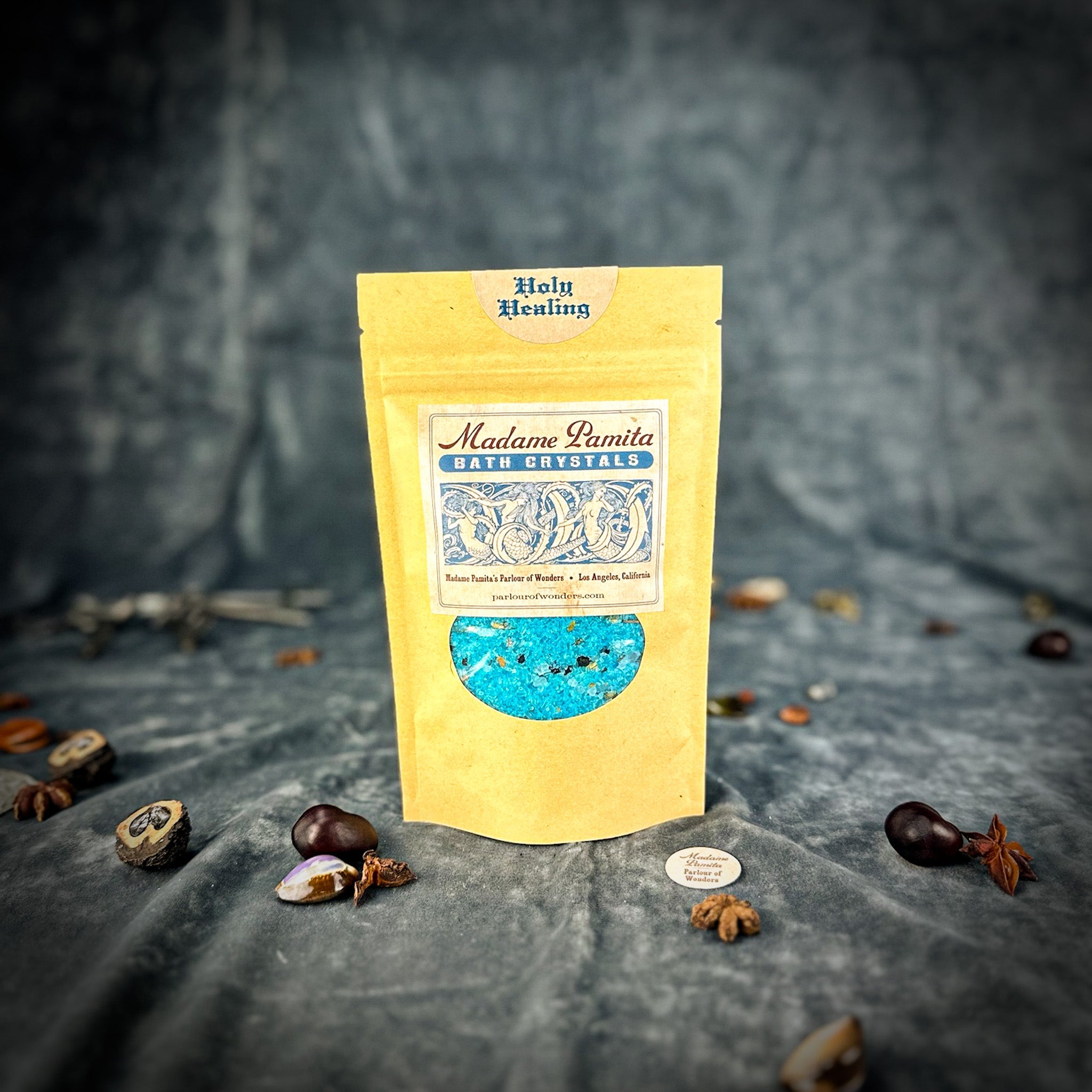 Small jar of Holy Healing Bath Crystals by Parlour of Wonders featuring colorful bath crystals in a clear container.