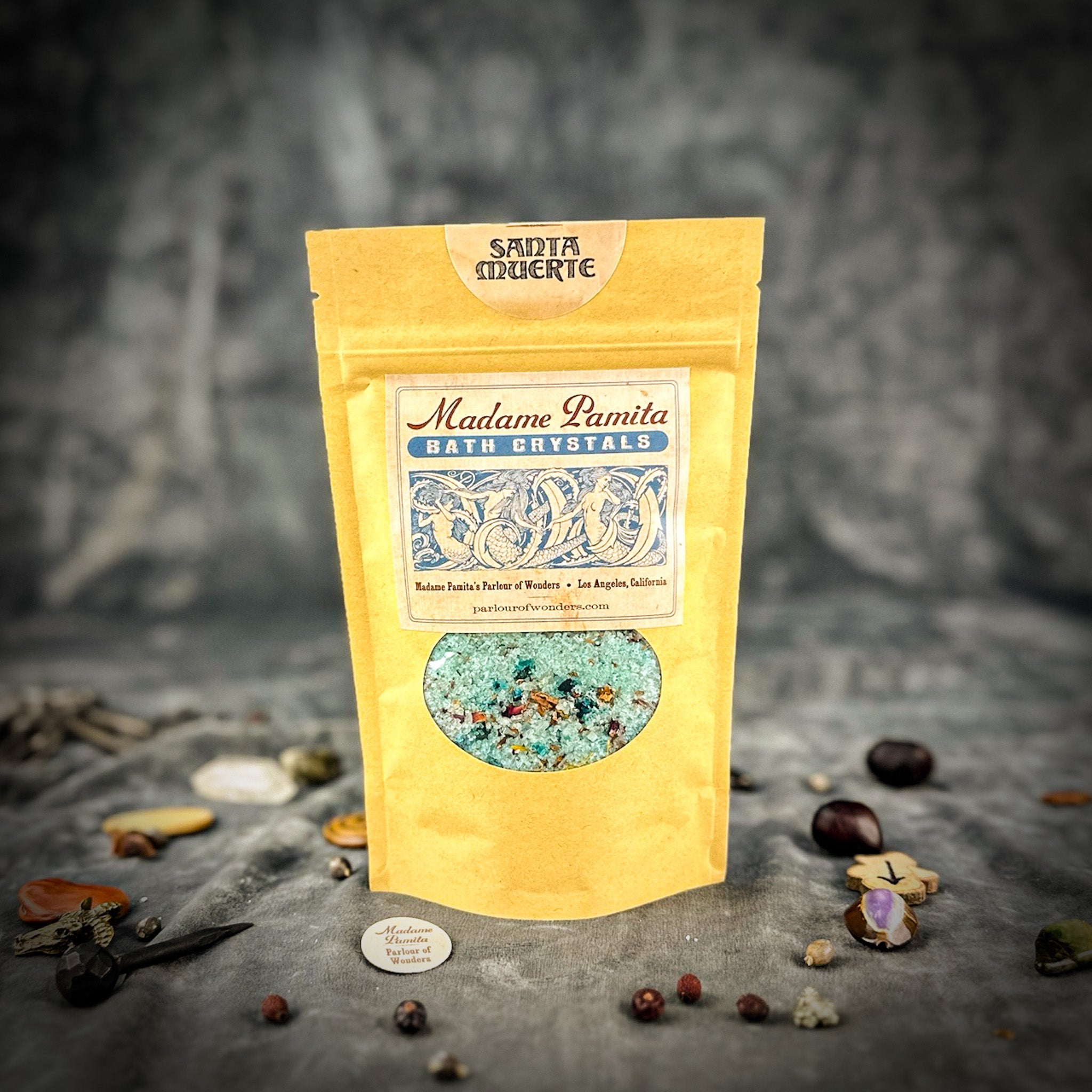 Small jar of Parlour of Wonders Santa Muerte Bath Crystals with decorative label and crystal bath salts for spiritual cleansing.