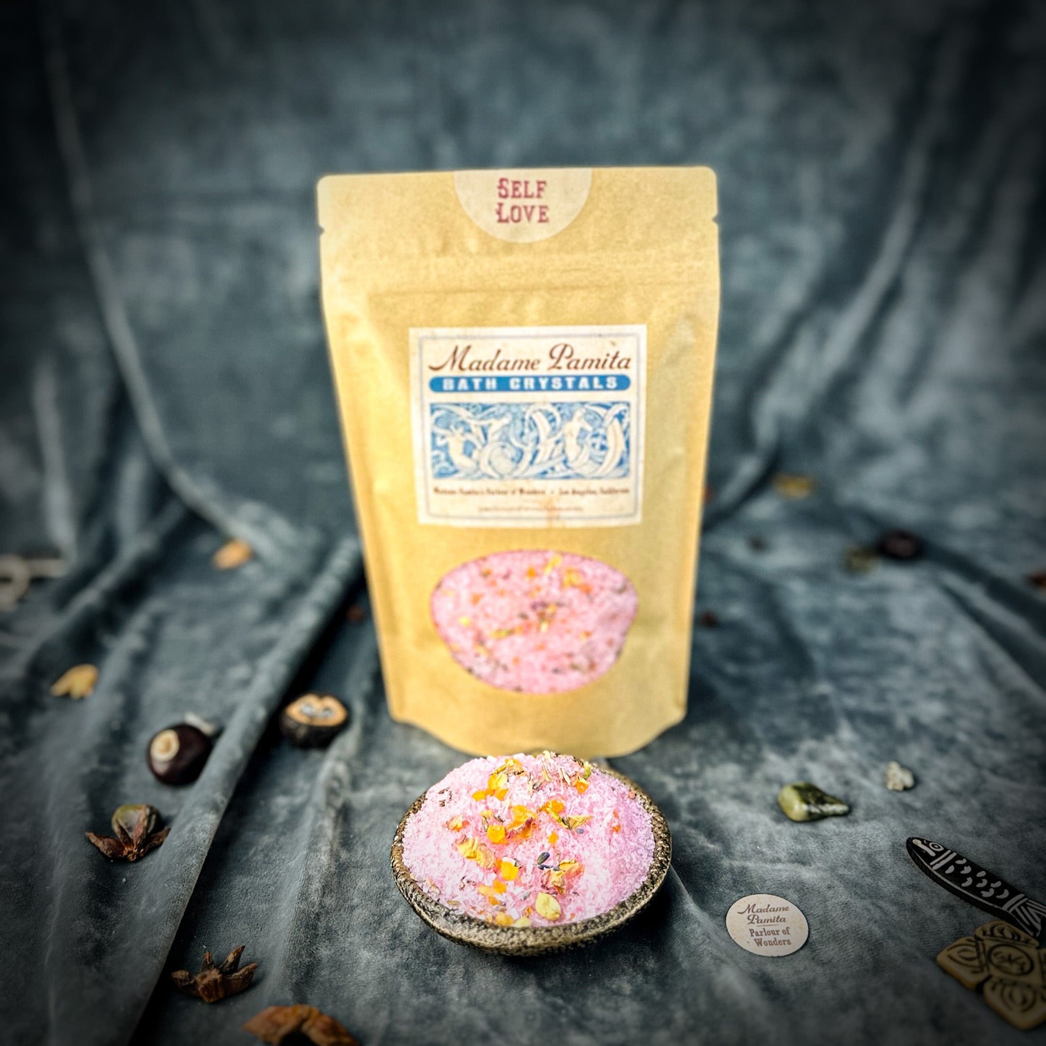Small jar of Parlour of Wonders Self Love Bath Crystals with colorful crystals for relaxing bath experience.
