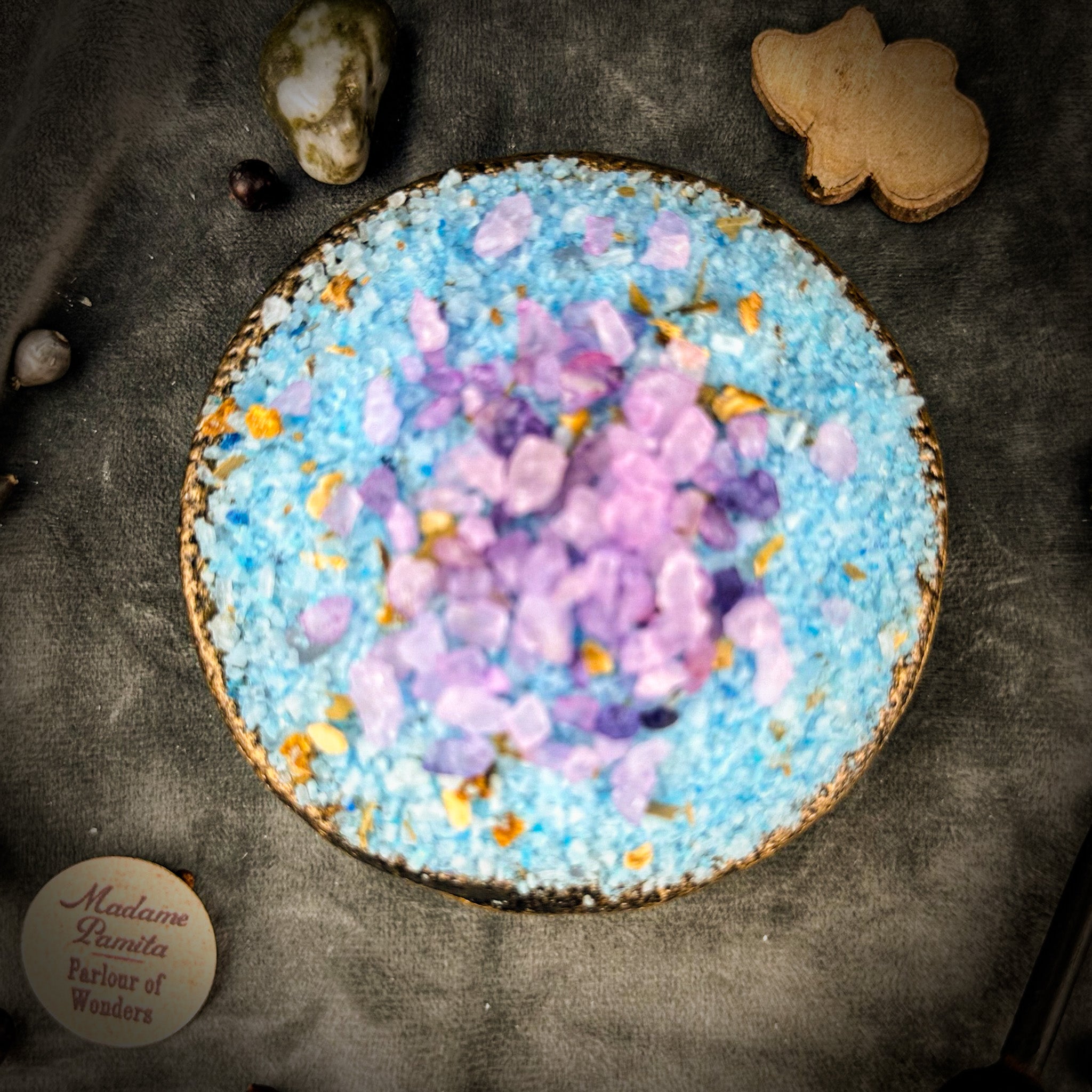 Small jar of Parlour of Wonders Smooth Separation Bath Crystals with pink and white bath salts in a clear container.