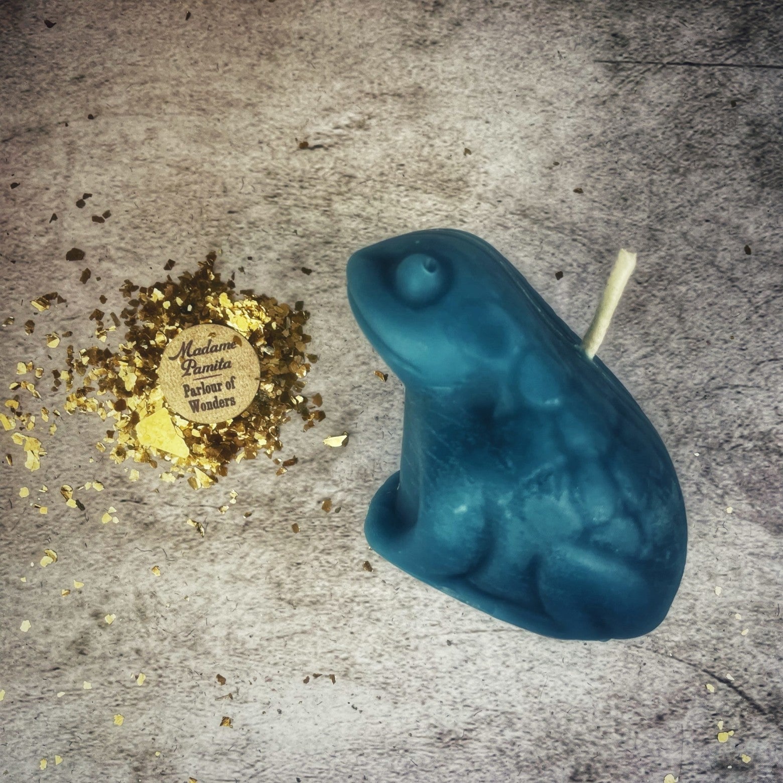 Black beeswax lucky money frog spell candle from Parlour of Wonders for abundance and prosperity magic.