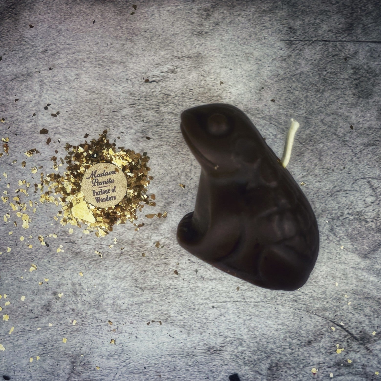 Black beeswax Lucky Money Frog spell candle by Parlour of Wonders for abundance and prosperity magic.