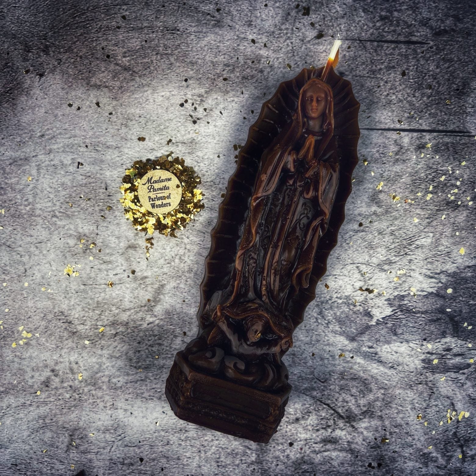 Blue beeswax candle featuring Nuestra Señora de Guadalupe for divine Mother and miracle spells, crafted by Parlour of Wonders.