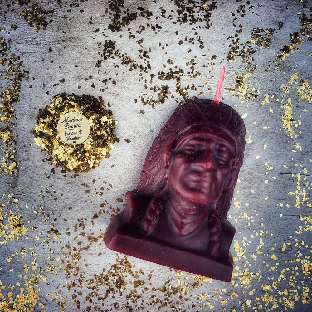 Beeswax Black Hawk Spell Candle by Parlour of Wonders, used for spirit guide and social justice magic. Brown beeswax, detailed design.