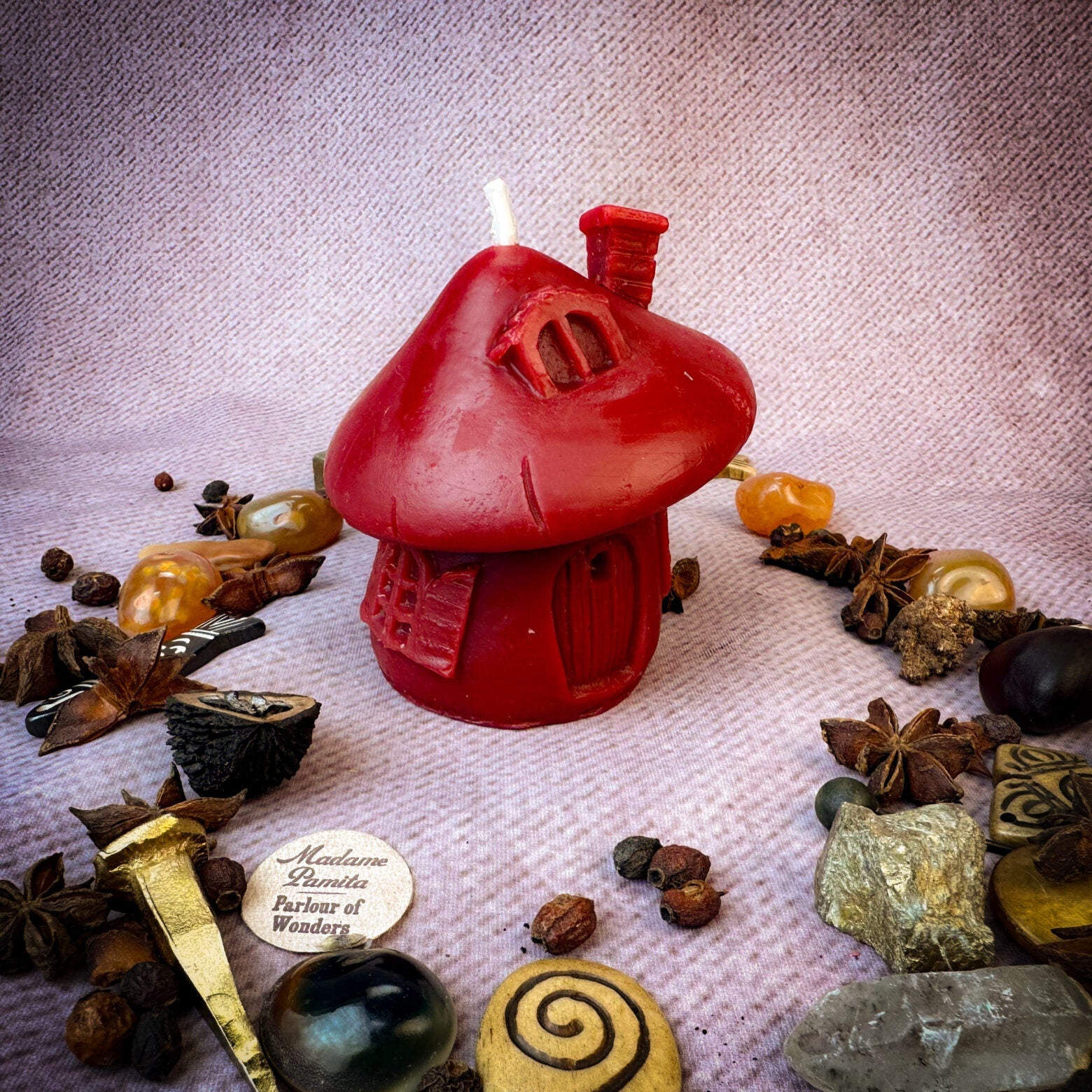 Green beeswax mushroom fairy hut candle by Parlour of Wonders, featuring a cozy mushroom design for sanctuary and blessing magic.