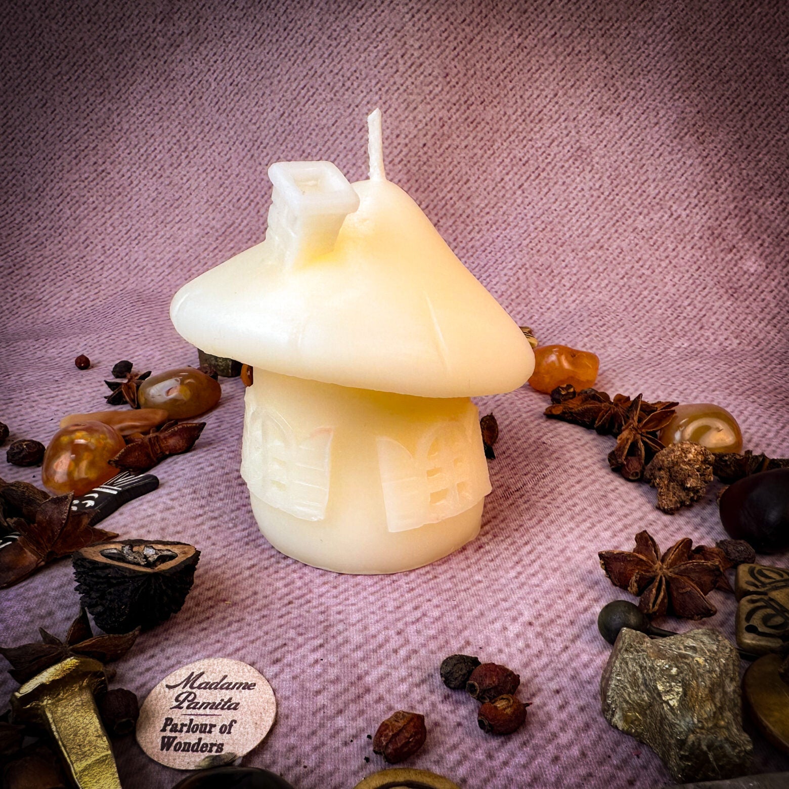 Green beeswax mushroom fairy hut candle by Parlour of Wonders, featuring a cozy fairy home design for sanctuary and blessing magic.